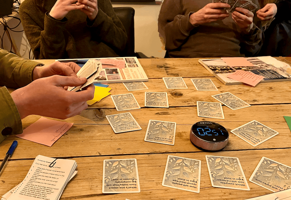 Close-up of Timescape scenario cards spread on a table during a session